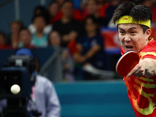Table Tennis-China gold medalist Wang's joy cut short by paparazzi paddle accident