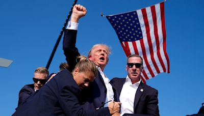 Photo of bloodied Trump fist pumping immediately spotlighted by his allies