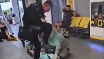 Watch: Armed policeman ‘stamps on man’s head’ at Manchester Airport