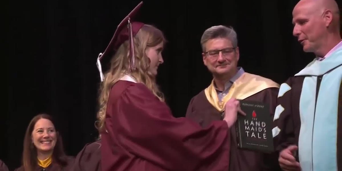 Banned book given to school superintendent during graduation ceremony