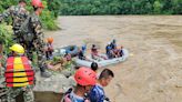 Two buses carrying more than 50 people swept into river by landslide in Nepal