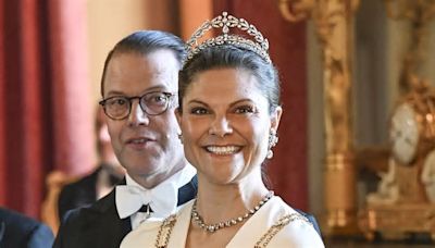 Crown Princess Victoria of Sweden is the image of glamour in a flowing white gown - as her father King Carl Gustaf hosts gala dinner for Finnish President and his wife