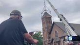 Lake Placid Catholic church installs new steeple top, cross