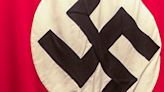 'You just cost yourself your business': Residents rebel against tire shop flying Nazi flag