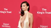 Emily Ratajkowski's String Bikini Was Covered in Photos of Swimsuit-Clad Women