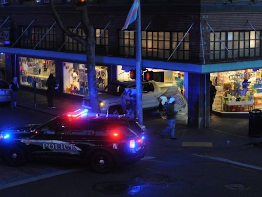 Pickup crashes through display window of downtown Olympia business