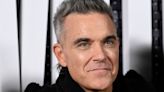 Robbie Williams 'beating himself up' after awkward 'rude' encounter with Cher