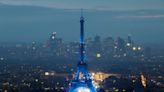 Eiffel Tower glows on rainy night, but many fans can't see opening ceremony