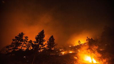 Bridge Fire explodes in size, prompts evacuations and burns homes in Southern California