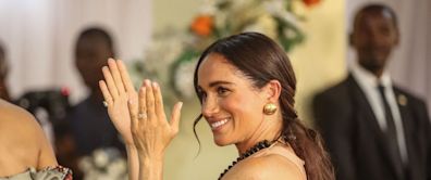 Meghan Markle Opted for a Pale Pink Maxi Dress on Day 1 of Her Trip to Nigeria
