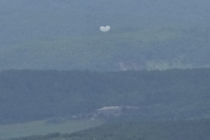 Trash dropped by a North Korean balloon falls on South Korea’s presidential compound