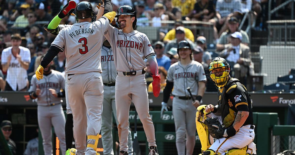 Joc Pederson of the Arizona Diamondbacks celebrates with Corbin Carroll after hitting a three-run home run in the seventh inning against the Pittsburgh Pirates at PNC Park...