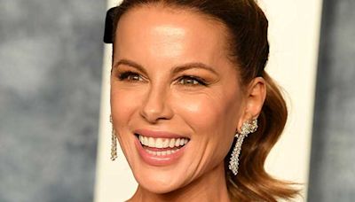 Kate Beckinsale showcases washboard abs in micro bikini in new photos