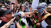 US campus protests: Rival Gaza protest groups clash at UCLA