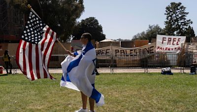 Ole Miss counter-protesters sing US national anthem, taunt pro-Palestine demonstrators