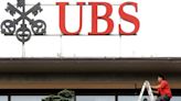 Analysis-Takeover benefits: UBS investors warm to Credit Suisse deal