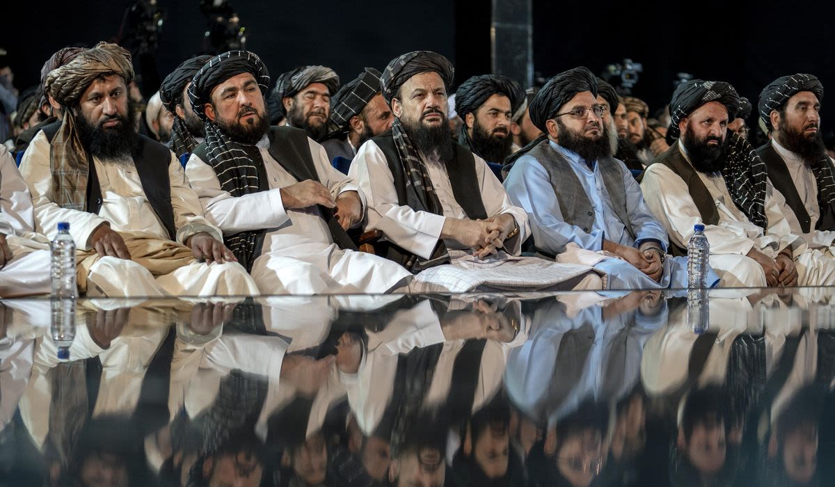 A gunman kills 6 worshippers inside a Shiite mosque in western Afghanistan, the Taliban say