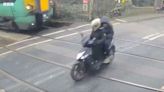 Moped riders ‘split seconds away from death’ after narrowly avoiding train at level crossing