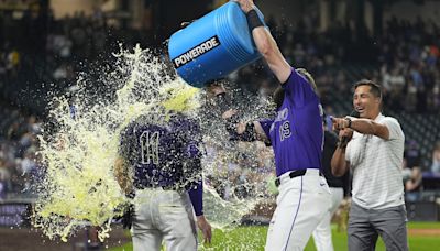Jake Cave hits an RBI single in the 10th inning to lift the Rockies over the Brewers 8-7