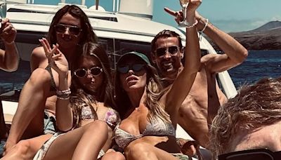 Abbey Clancy flaunts her figure in a white bikini during sunny getaway