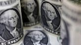 Dollar climbs for the week, cyber outage unsettles investors