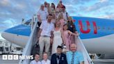 Newlyweds delight Bristol passengers by flying in bridal gear