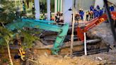 Malaysia halts rescue operation for woman who plunged into sinkhole