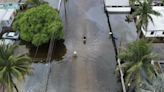 Tropical rainstorms in South Florida lead to flight delays and streets jammed with stalled cars