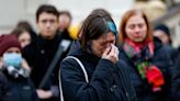 Czechs mourn victims of university shooting as police patrol public areas