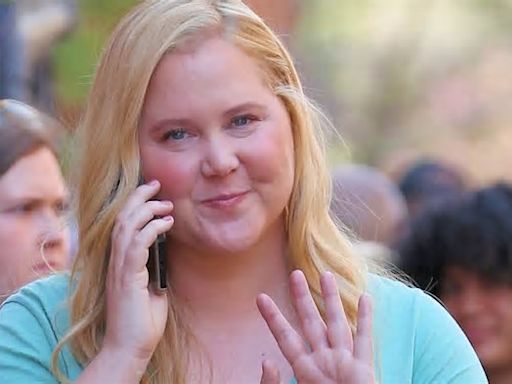 Amy Schumer looks thinner in a T-shirt and mini skirt while filming Kinda Pregnant in NYC... after revealing Cushing Syndrome caused bloating