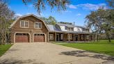 This San Antonio log cabin comes with a private creek and 10 acres of land