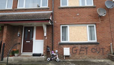 Race hate attack: Family, including children, flee home after windows smashed and graffiti daubed on wall