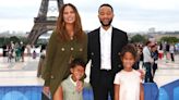 Chrissy Teigen Embraces Knitting in Chloé’s Micro Shorts, John Legend Suits Up in Louis Vuitton for Paris Olympics Opening Ceremony