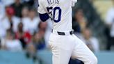 The Los Angeles Dodgers' Mookie Betts hits a leadoff home run during the first inning against the Cincinnati Reds at Dodger Stadium on Friday, May 17, 2024...