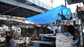 Kolkata Municipal Corporation instals metal panels at back of some hawkers’ stalls in Gariahat