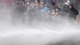 Argentine riot police disperse protesters with water cannons ahead of key Senate vote