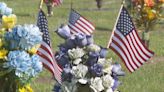 American flags planted at Evergreen Memorial Park Cemetery in honor of fallen heroes