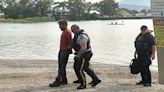 Man wearing sweater, pants, boots arrested after swimming in Okanagan Lake