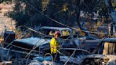 SoCal fires burn 100,000 acres, destroy dozens of homes and injure 13