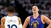 Nikola Jokic of the Denver Nuggets reacts in front of Minnesota's Mike Conley in the Nuggets' NBA playoff victory over the Timberwolves