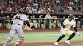 ...Arizona Diamondbacks' Christian Walker, right, is caught in a rundown with San Francisco Giants catcher Patrick Bailey during the fourth inning at Chase Field on Tuesday...