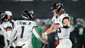 Jacksonville Jaguars exercise fifth-year options on QB Trevor Lawrence, RB Travis Etienne