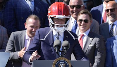 Biden hosts Super Bowl champion Chiefs, dons KC helmet