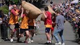 Chasing cheese wheels or lugging sacks of wool, UK competitors embrace quirky extreme races