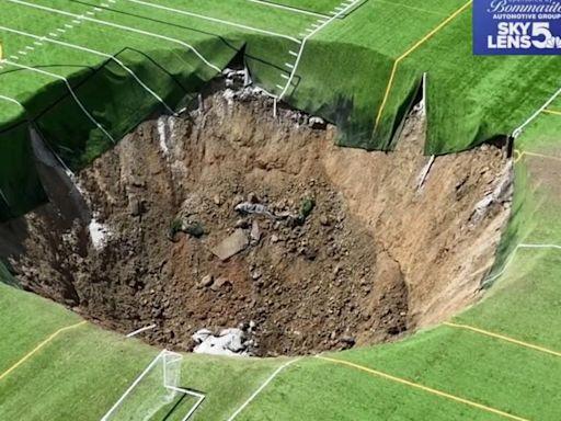 Football pitch swallowed up by 100ft-wide sinkhole