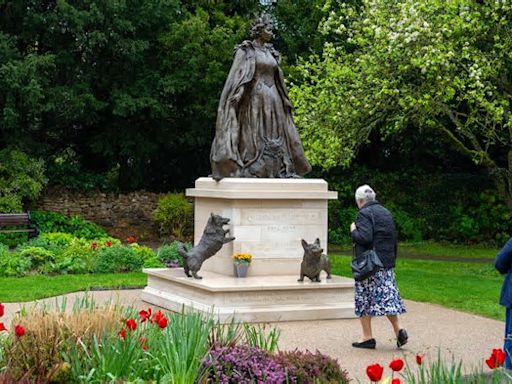 See the bronze, corgi-adorned statue honoring Queen Elizabeth II on her 98th birthday: Photos