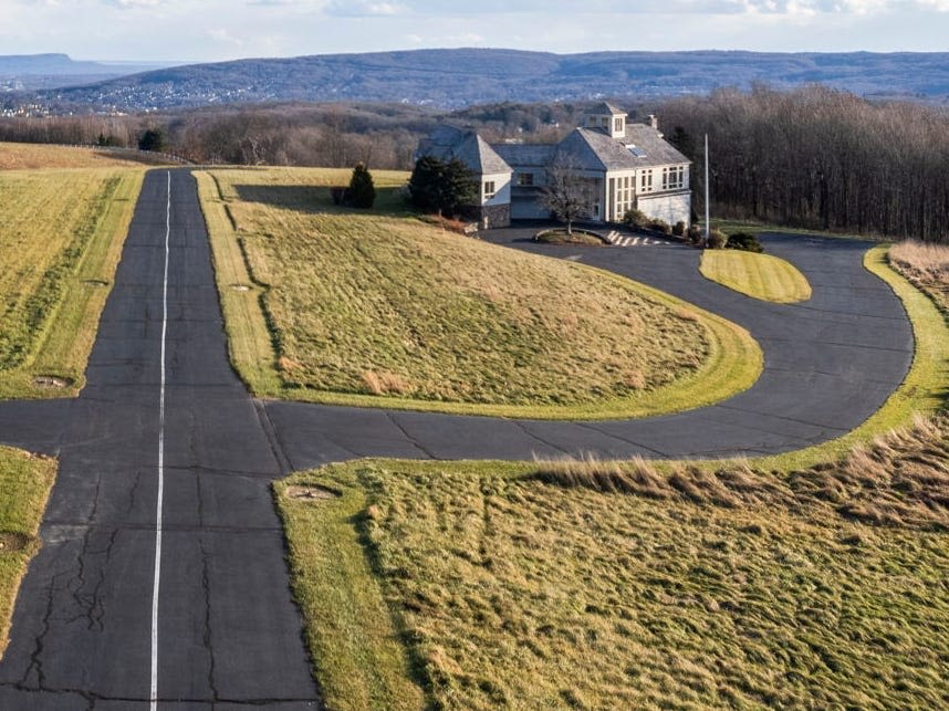 A Connecticut home with a private FAA-approved airstrip and hangar has hit the market for $2.9 million. Take a look.