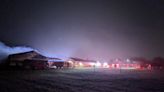 Firefighters working to put out early morning fire at Kelloggsville Public Schools bus garage