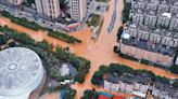 Floods from waning typhoon hit transport, force evacuations in China