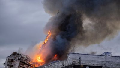 Fire engulfs Denmark’s historic stock exchange building, iconic spire collapses